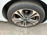 a close up of a tire on a car ' s rim