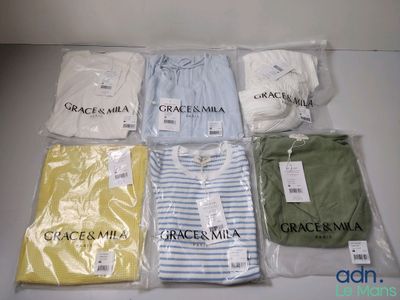 a lot of clothes that are sitting on a table