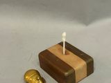 a small wooden box with a candle on top of it