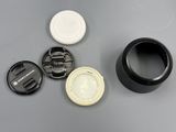 a camera lens cap and a camera lens cap on a table