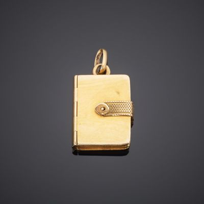 a gold locke with a key on a black background