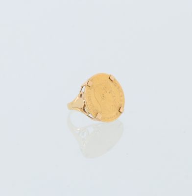 l'image d'un anneau d'or avec une pièce de monnaie au milieu