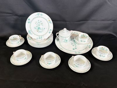 an image of a group of tea cups and saucers on a table