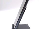 a cell phone that is sitting on top of a stand