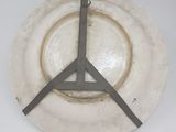 a white plate with a clock on it on the wall