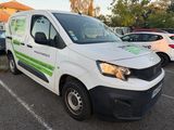 a white van that is parked in a parking lot