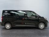 the black van is parked in the garage with its door open