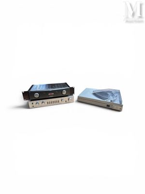 two cassette players sitting next to each other on a white surface