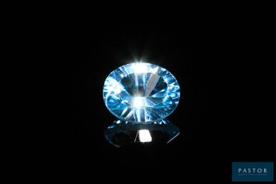 a close up of a blue diamond on a black background