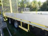 a truck that is parked on the grass in the yard