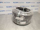 a close up of a coil of gray hose on a table