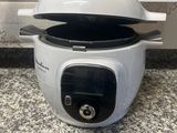 a white rice cooker sitting on a counter top