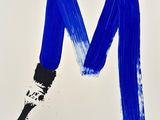 a painting of a letter m painted with blue paint on a white background
