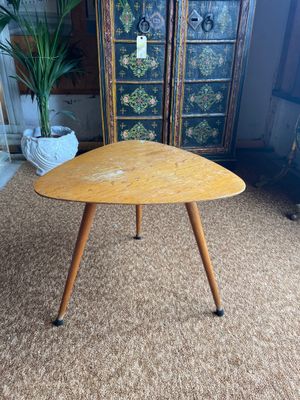 a wooden table with two legs and a wooden top