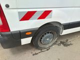 a white van with a red stripe on the side of it