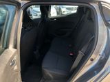 the back seat of a car with the door open in a parking lot