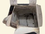 a white box with a handle and a hole in it