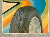 a picture of a car tire on a colorful wall