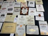 many different types of wine labels on a table