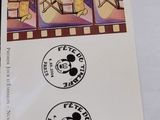 mickey mouse stamps are on a piece of paper with a picture of mickey mouse