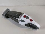 a black and white cordless vacuum cleaner on a white surface