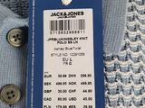 a close up of a tag on a blue sweater