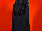 an image of a mannequin with a black shirt on a red background