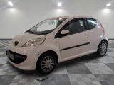 a picture of a small white car parked in a garage