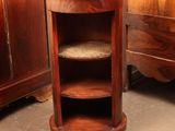 a wooden cabinet with a glass top in a room