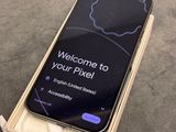 an iphone is sitting on top of a box with a welcome sign on it