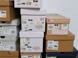 boxes stacked on top of each other on a table in front of a white wall