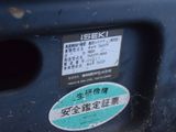 a close up of a parking meter with a sticker on it
