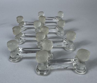 several clear glass knobs are arranged on top of each other