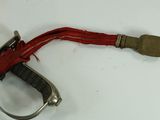 a small knife with a red ribbon on it