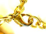 a close up of a gold chain on a white background