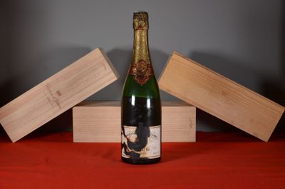 a bottle of wine that is sitting on a table