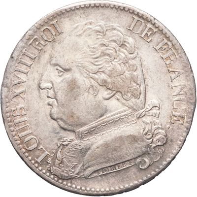 gros plan d'une pièce de monnaie sur fond blanc