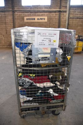 a metal cart with many items in it in a warehouse