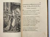 an open book with a picture of a woman in a dress