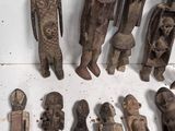a lot of wooden figurines that are sitting on a table