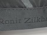 a close up of a label on a black jacket