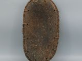 an image of a brown oval shaped object on a white surface