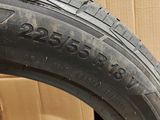 a close up of a tire on a cardboard box with a cardboard box in the background