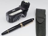 a pen, ink bottle, and a case on a table