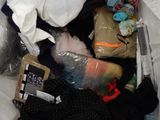 a bag full of clothes and other items in it