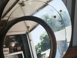 a mirror that is sitting on a wooden table
