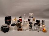 a lot of different perfume bottles sitting on a table