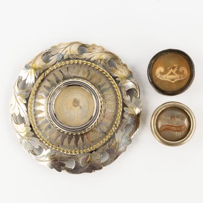 a silver and gold plate with a small bowl on it
