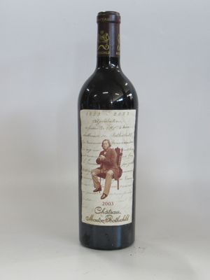 a bottle of wine that is sitting on a table