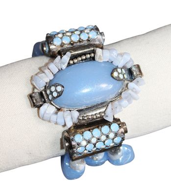 bracelet with a blue stone and glass beads on a white napkin